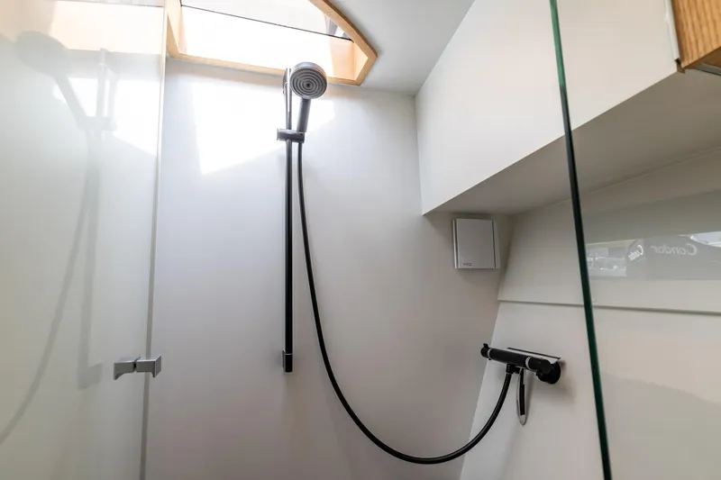  Yacht Photos Pics Modern shower area in 2024 Vripack 42 Open Kuip yacht, featuring sleek design and natural light.