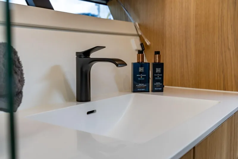  Yacht Photos Pics Modern bathroom sink with black faucet on Vripack 42 Open Kuip yacht, 2024 model.