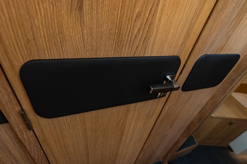  Yacht Photos Pics Wooden interior door with sleek black handle on 2024 Vripack 42 Open Kuip yacht.