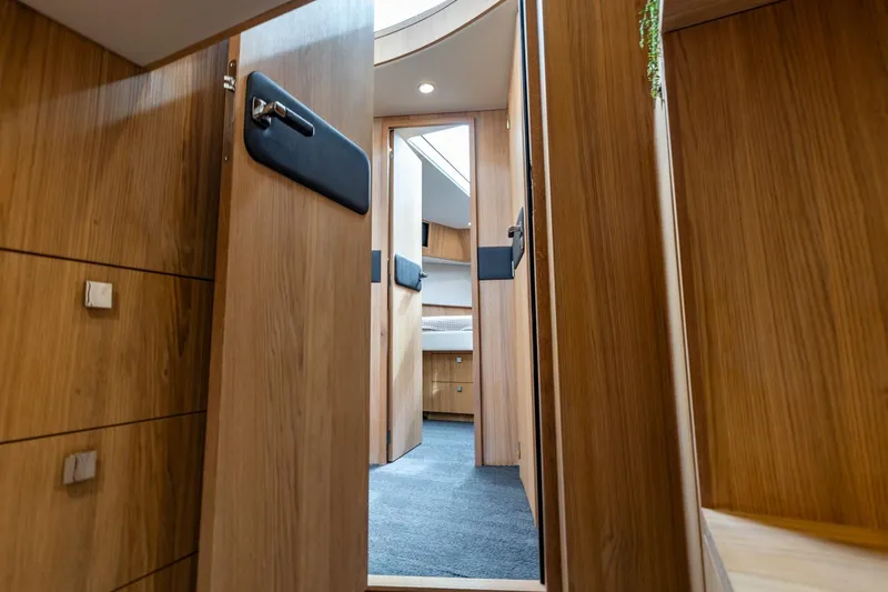  Yacht Photos Pics Interior of 2024 Vripack 42 Open Kuip yacht, featuring wooden cabinetry and modern design.