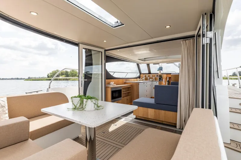  Yacht Photos Pics Luxurious interior of 2024 Vripack 42 Open Kuip yacht with modern seating and dining area.
