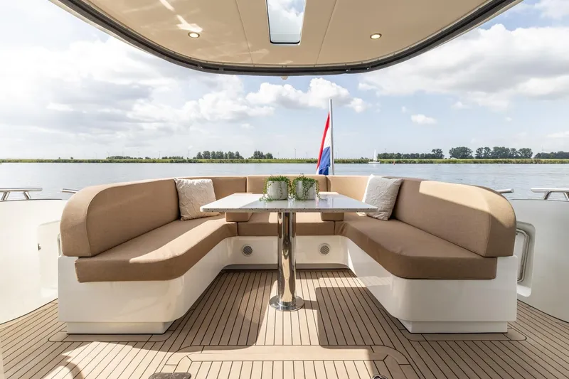  Yacht Photos Pics Luxurious 2024 Vripack 42 Open Kuip yacht with elegant seating and scenic water view.