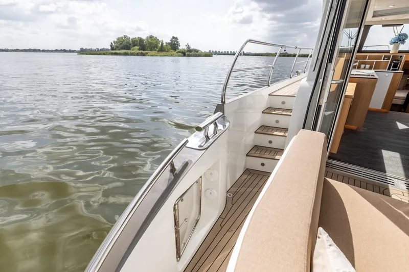  Yacht Photos Pics Luxurious Vripack 42 Open Kuip yacht interior with scenic water view, 2024 model.