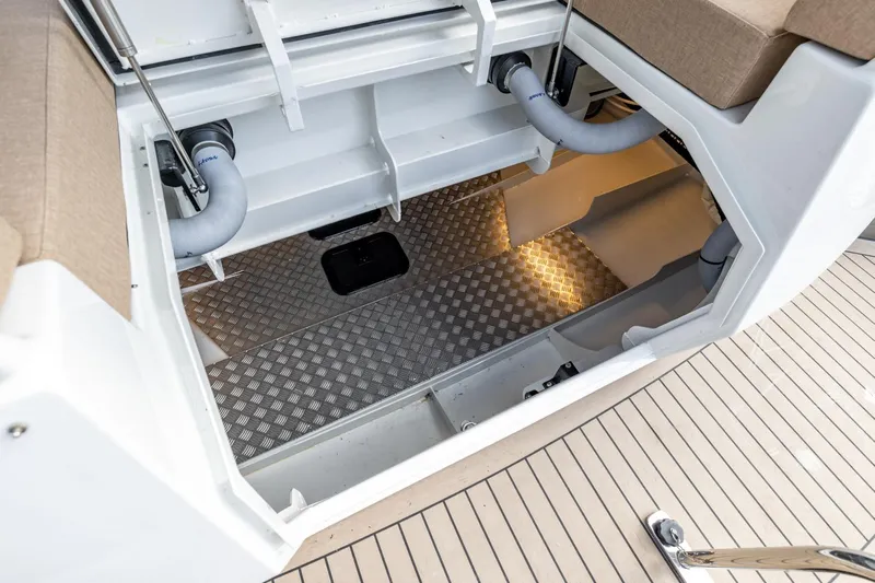  Yacht Photos Pics Open storage compartment of 2024 Vripack 42 Open Kuip with stabilizers, featuring metal flooring.