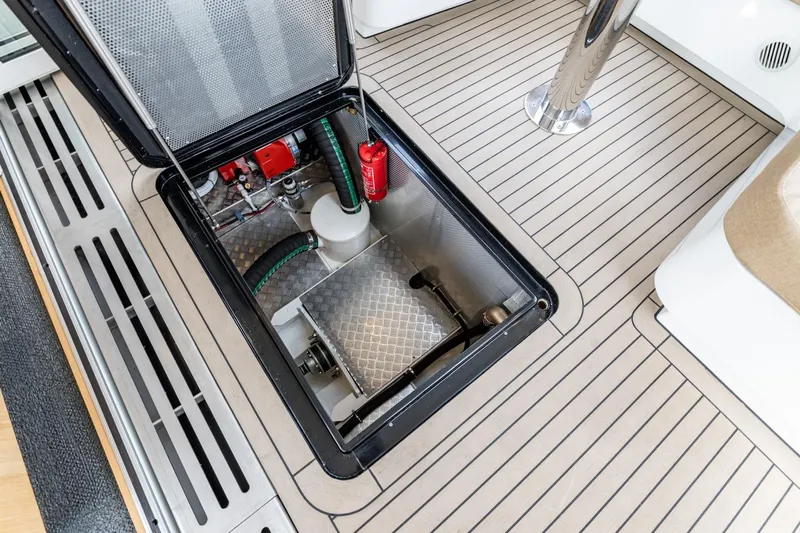  Yacht Photos Pics Open hatch on 2024 Vripack 42 Open Kuip, revealing mechanical components and fire extinguisher.