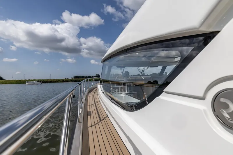  Yacht Photos Pics 2024 Vripack 42 Open Kuip yacht on calm water under blue sky.