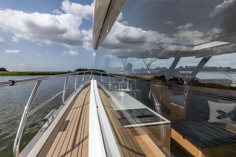  Yacht Photos Pics 2024 Vripack 42 Open Kuip yacht with sleek design and modern interior on calm waters.