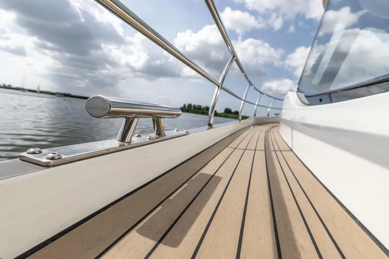  Yacht Photos Pics 2024 Vripack 42 Open Kuip yacht deck with sleek railing and scenic water view.