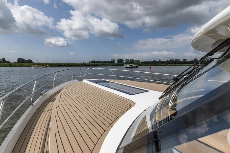  Yacht Photos Pics 2024 Vripack 42 Open Kuip yacht on calm water under a partly cloudy sky.