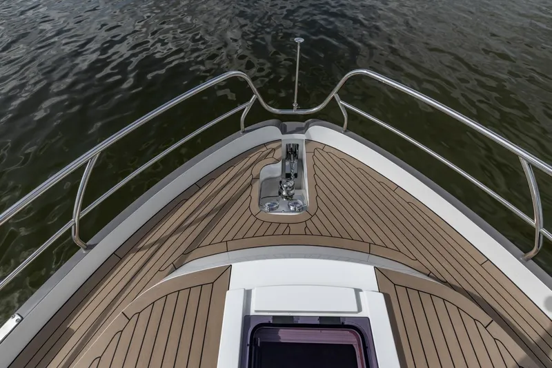  Yacht Photos Pics Bow view of 2024 Vripack 42 Open Kuip yacht with teak decking and stainless steel railings.
