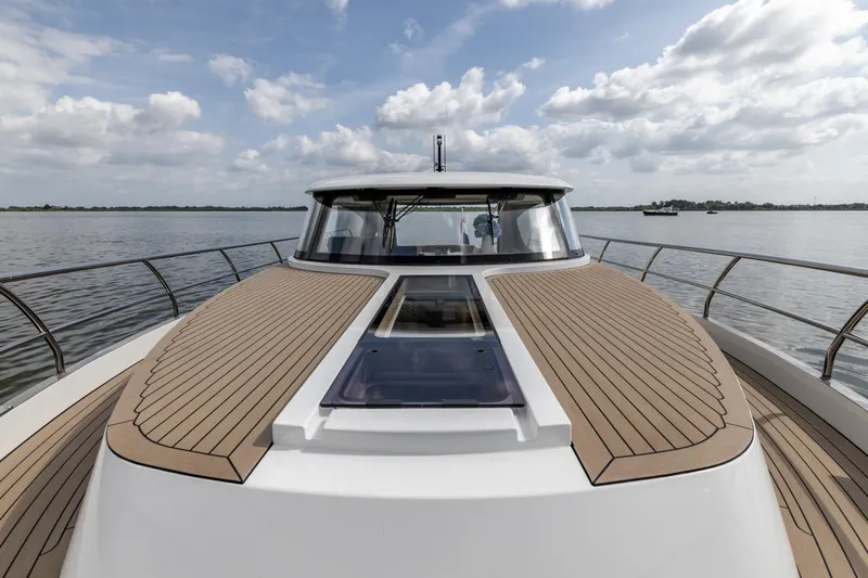  Yacht Photos Pics 2024 Vripack 42 Open Kuip yacht with stabilizers on calm water under cloudy sky.