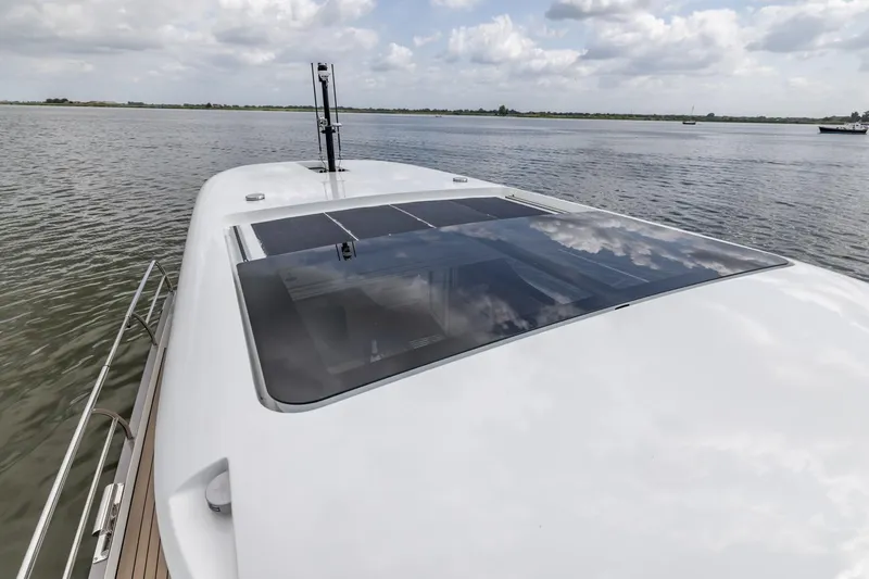  Yacht Photos Pics 2024 Vripack 42 Open Kuip yacht with stabilizers on calm water under cloudy sky.