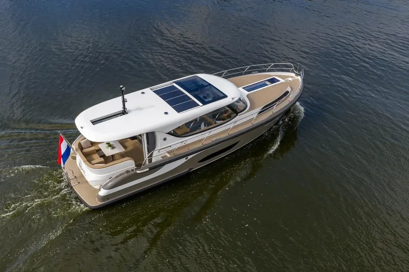  Yacht Photos Pics 2024 Vripack 42 Open Kuip yacht cruising on water, featuring sleek design and stabilizers.
