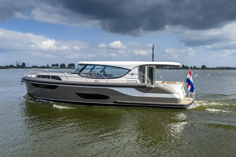  Yacht Photos Pics 2024 Vripack 42 Open Kuip yacht with stabilizers cruising on a calm lake.