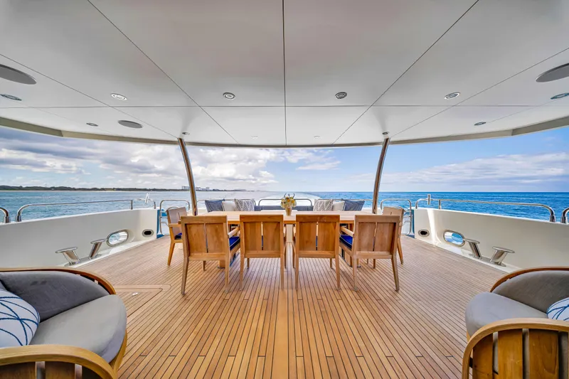 Natural 9 Yacht Photos Pics Luxurious Sunseeker 37 Metre Yacht 2009 with elegant outdoor dining area and ocean view.