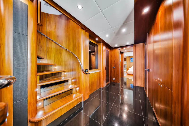 Natural 9 Yacht Photos Pics Luxurious wooden interior of 2009 Sunseeker 37 Metre Yacht with elegant staircase and glossy flooring.