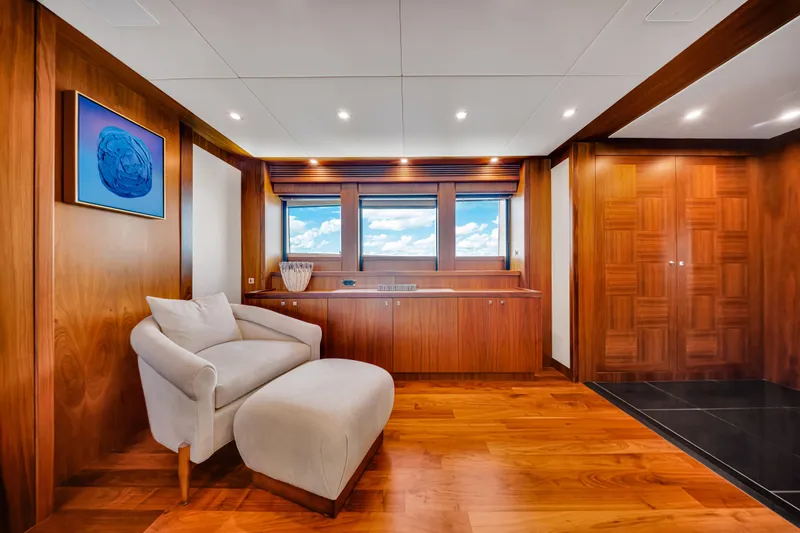 Natural 9 Yacht Photos Pics Luxurious interior of 2009 Sunseeker 37 Metre Yacht with elegant wood paneling and plush seating.