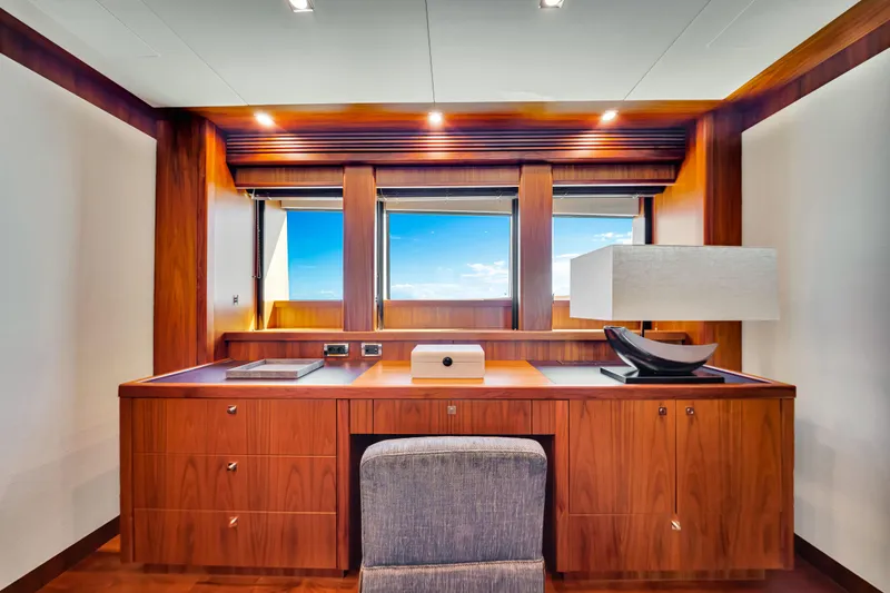 Natural 9 Yacht Photos Pics Luxurious wooden desk area on 2009 Sunseeker 37 Metre Yacht with ocean view.