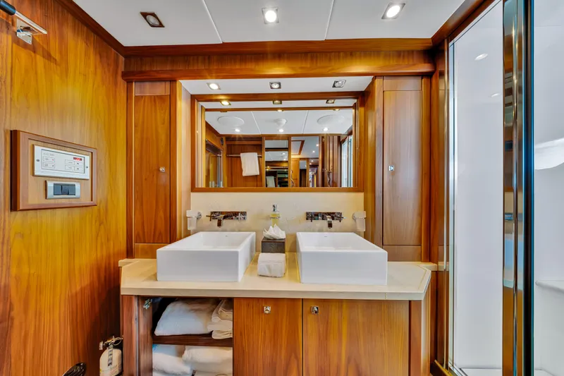 Natural 9 Yacht Photos Pics Luxurious bathroom on 2009 Sunseeker 37 Metre Yacht with dual sinks and wooden cabinetry.