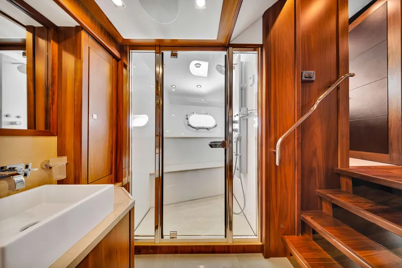 Natural 9 Yacht Photos Pics Luxurious bathroom on 2009 Sunseeker 37 Metre Yacht with wooden accents and modern fixtures.