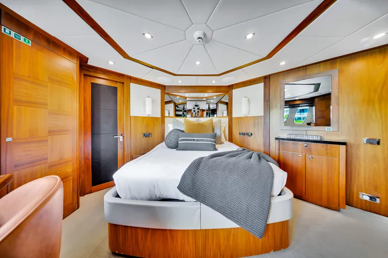 Natural 9 Yacht Photos Pics Luxurious bedroom interior on 2009 Sunseeker 37 Metre Yacht with modern wood paneling.