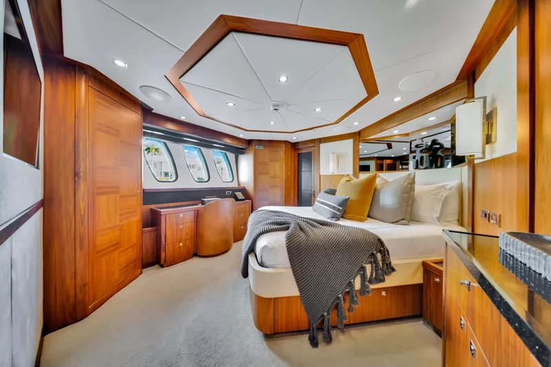 Natural 9 Yacht Photos Pics Luxurious bedroom interior of 2009 Sunseeker 37 Metre Yacht with elegant wood finishes.