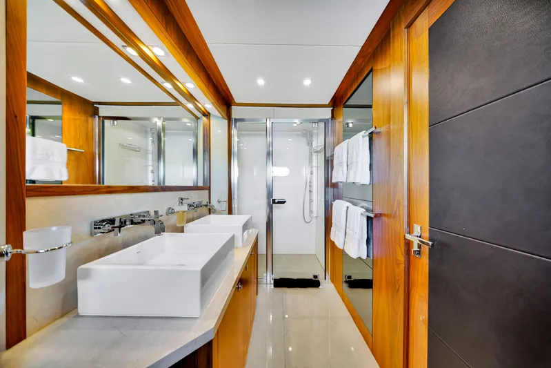 Natural 9 Yacht Photos Pics Luxurious bathroom on 2009 Sunseeker 37 Metre Yacht with dual sinks and modern shower.