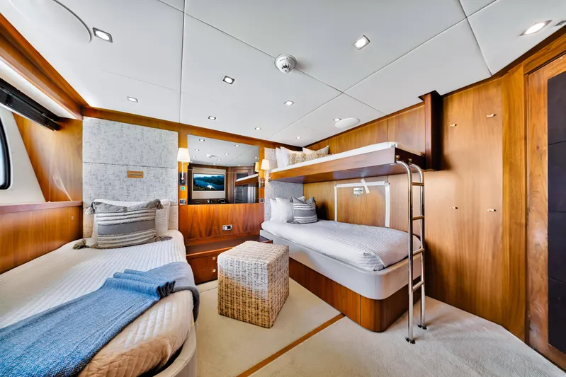 Natural 9 Yacht Photos Pics Luxurious cabin interior of 2009 Sunseeker 37 Metre Yacht with bunk beds and elegant decor.