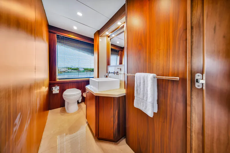 Natural 9 Yacht Photos Pics Luxurious bathroom on 2009 Sunseeker 37 Metre Yacht with wood paneling and modern fixtures.