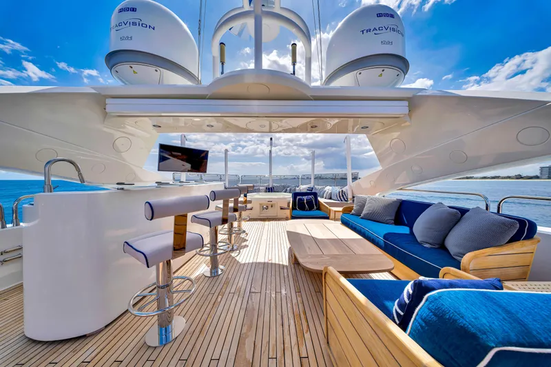 Natural 9 Yacht Photos Pics Luxurious Sunseeker 37 Metre Yacht 2009 with elegant outdoor seating and ocean view.