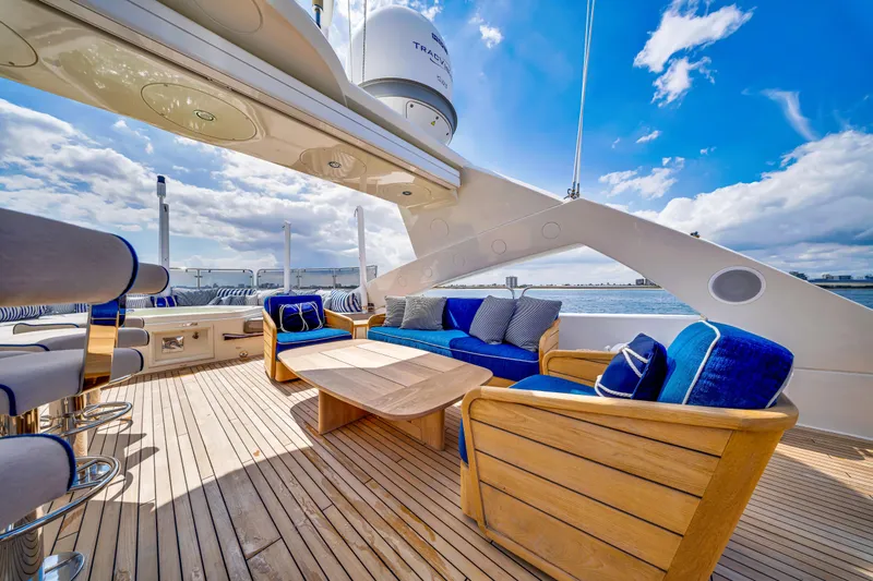 Natural 9 Yacht Photos Pics Luxurious Sunseeker 37 Metre Yacht 2009 with elegant outdoor seating and ocean view.