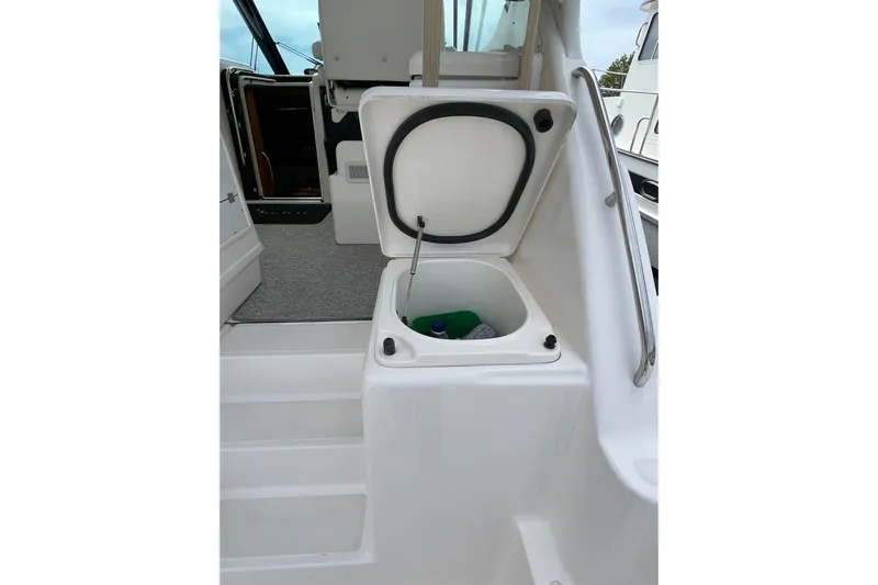 Sasea Yacht Photos Pics 2009 Tiara Yachts 4200 Open boat with open storage compartment on deck.