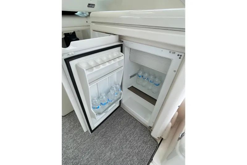 Sasea Yacht Photos Pics Mini fridge on 2009 Tiara Yachts 4200 Open, stocked with water bottles.