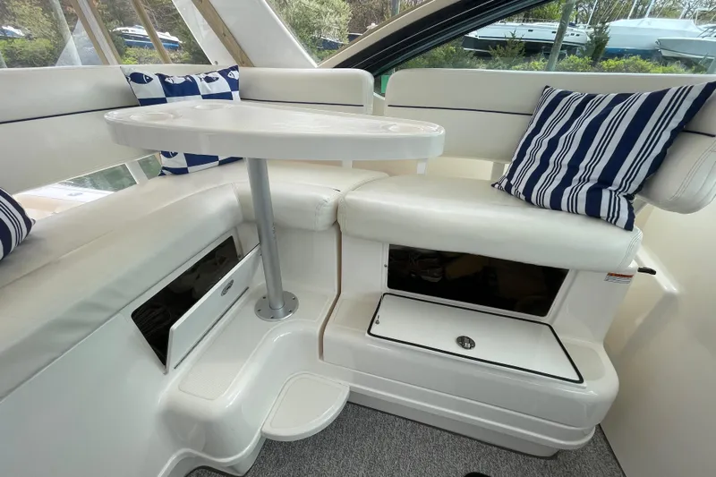 Sasea Yacht Photos Pics 2009 Tiara Yachts 4200 Open interior with white seating and striped cushions.