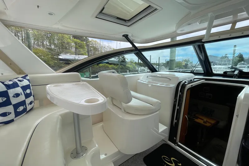 Sasea Yacht Photos Pics 2009 Tiara Yachts 4200 Open interior with seating, table, and scenic marina view.