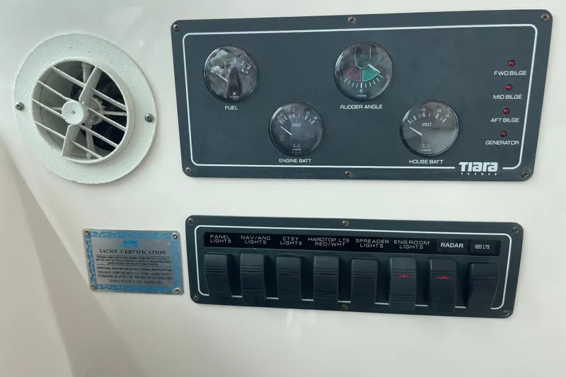 Sasea Yacht Photos Pics Control panel of a 2009 Tiara Yachts 4200 Open, featuring gauges and switches.