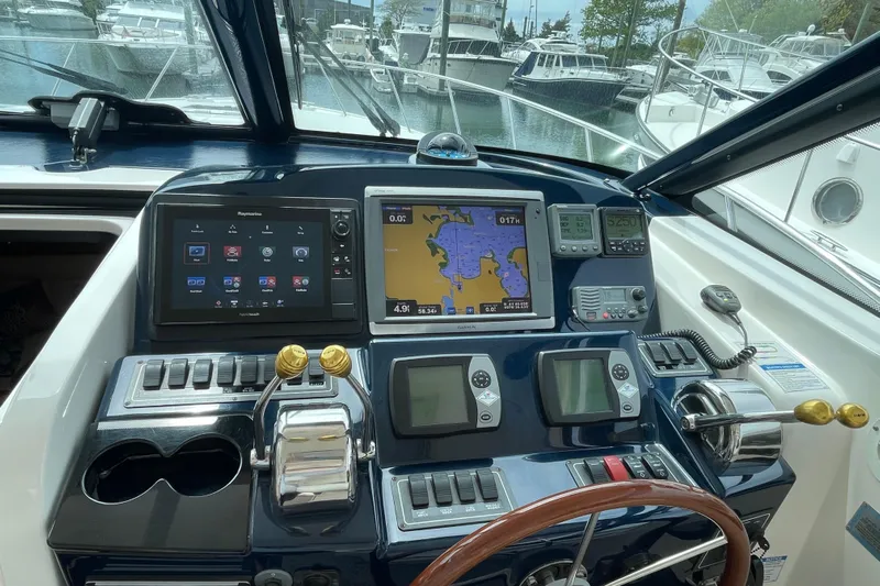 Sasea Yacht Photos Pics Helm of 2009 Tiara Yachts 4200 Open with navigation and control systems.