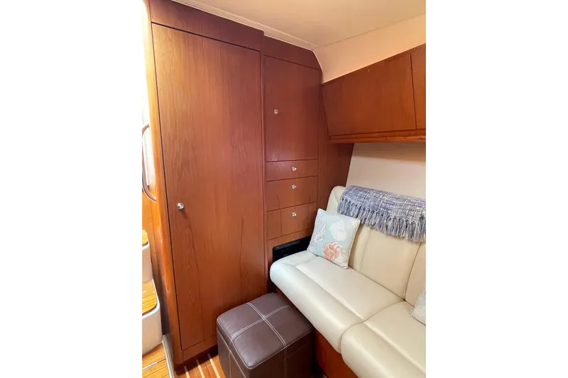 Sasea Yacht Photos Pics Interior of 2009 Tiara Yachts 4200 Open with wooden cabinetry and cream seating.