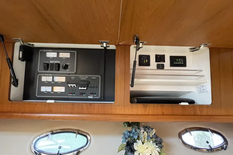 Sasea Yacht Photos Pics Electrical control panel inside 2009 Tiara Yachts 4200 Open, featuring AC and DC systems.