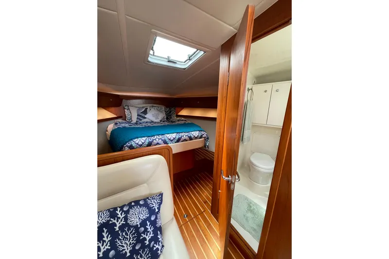 Sasea Yacht Photos Pics 2009 Tiara Yachts 4200 Open cabin interior with bed and bathroom.