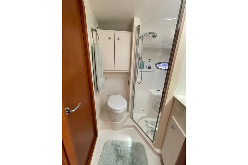 Sasea Yacht Photos Pics Luxurious bathroom in 2009 Tiara Yachts 4200 Open, featuring shower and modern amenities.