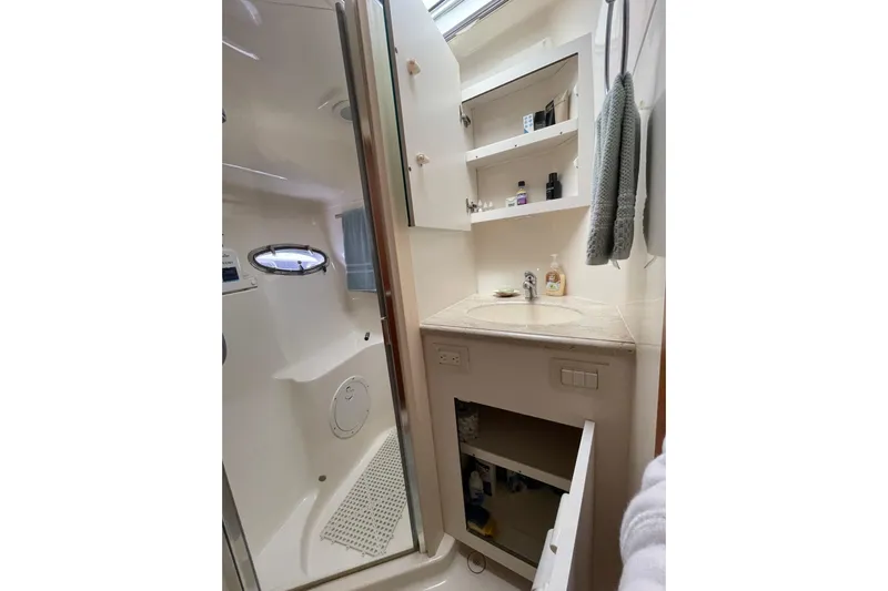 Sasea Yacht Photos Pics Bathroom interior of 2009 Tiara Yachts 4200 Open with shower and vanity.