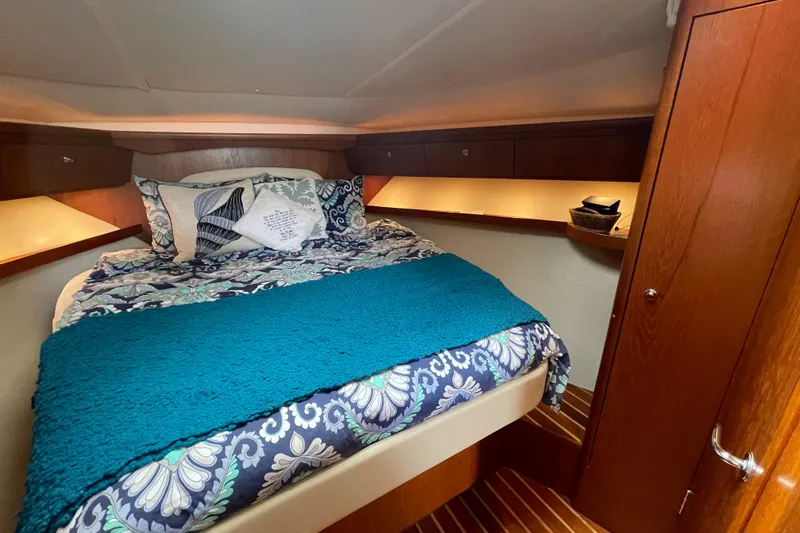 Sasea Yacht Photos Pics Luxurious cabin interior of 2009 Tiara Yachts 4200 Open with cozy bedding.
