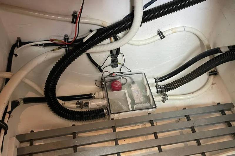 Sasea Yacht Photos Pics Engine compartment of 2009 Tiara Yachts 4200 Open, featuring hoses and wiring.