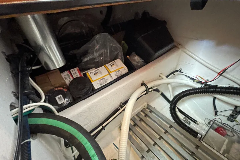 Sasea Yacht Photos Pics Storage compartment of a 2009 Tiara Yachts 4200 Open with various supplies and cables.