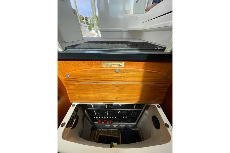 Sasea Yacht Photos Pics 2009 Tiara Yachts 4200 Open interior control panel with wooden finish.