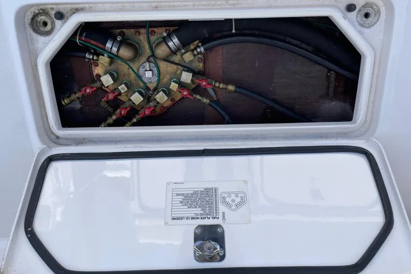 Sasea Yacht Photos Pics Access panel of a 2009 Tiara Yachts 4200 Open, showing internal components and wiring.