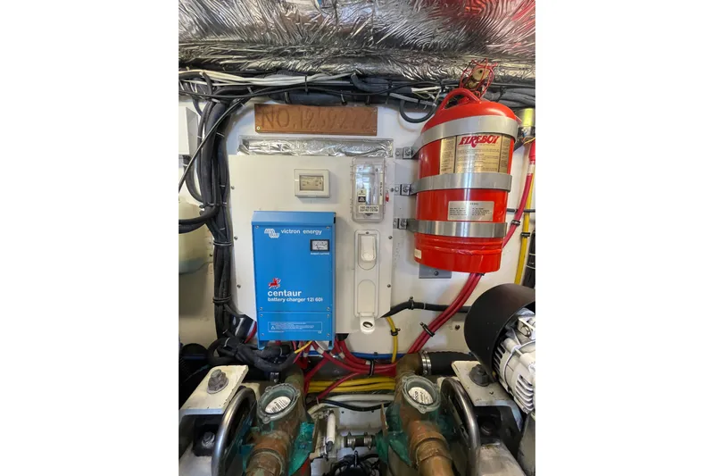 Sasea Yacht Photos Pics Engine room of 2009 Tiara Yachts 4200 Open with battery charger and fire extinguisher.