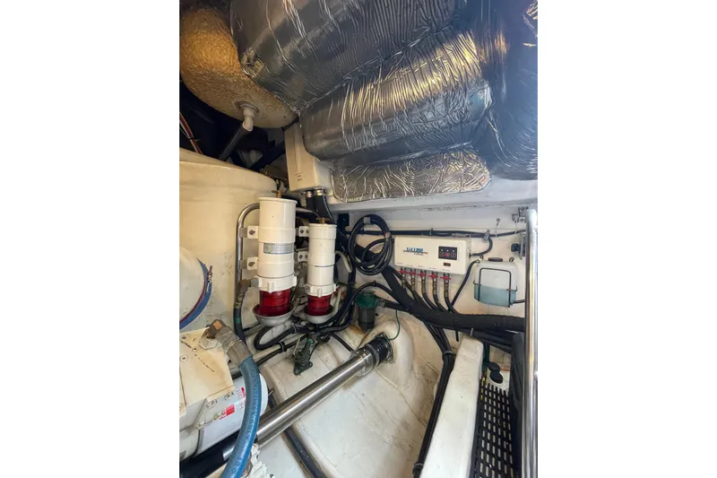 Sasea Yacht Photos Pics Engine room of 2009 Tiara Yachts 4200 Open, showcasing mechanical components and wiring.