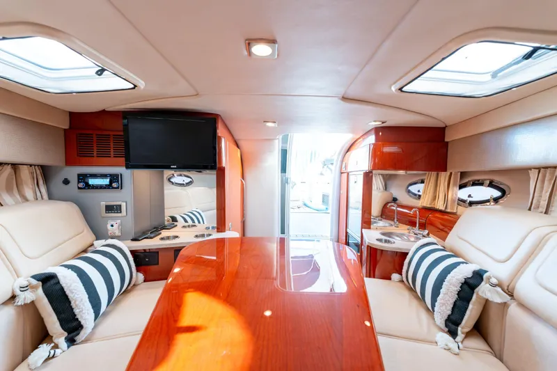  Yacht Photos Pics Luxurious interior of 2013 Formula 310 Sun Sport boat with plush seating and modern amenities.